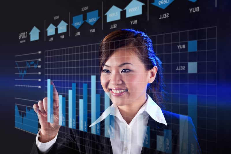 chinese business woman smiling with graph
