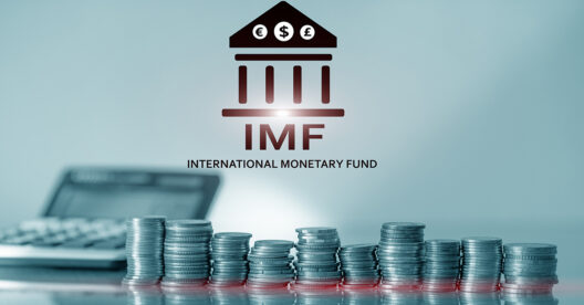 Intderntiona Monetary Fund logo and stacks of coins