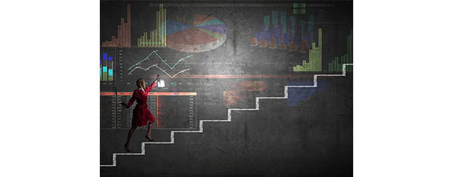 woman holding lantern up graph stairs