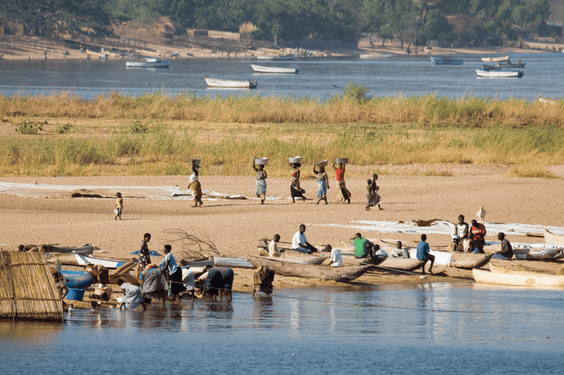 people of Malawai working by water