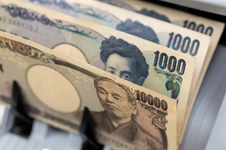 Money counting machine with Japanese yen. Business concept. Financial operations, exchange, currency, close up