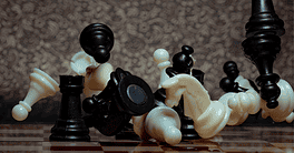 Chess board game. Business strategy management and success concept. Teamwork with competition and success strategic. Chess clash, bounce off on a board. Turn over chess board. Pieces of chess. Defeat.