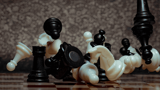Chess board game. Business strategy management and success concept. Teamwork with competition and success strategic. Chess clash, bounce off on a board. Turn over chess board. Pieces of chess. Defeat.