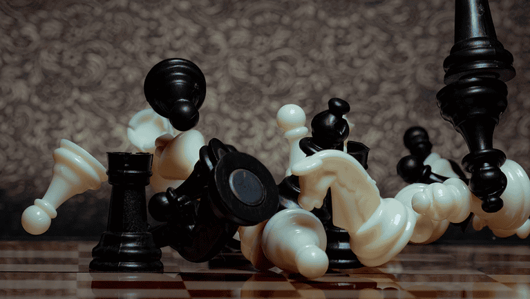Chess board game. Business strategy management and success concept. Teamwork with competition and success strategic. Chess clash, bounce off on a board. Turn over chess board. Pieces of chess. Defeat.