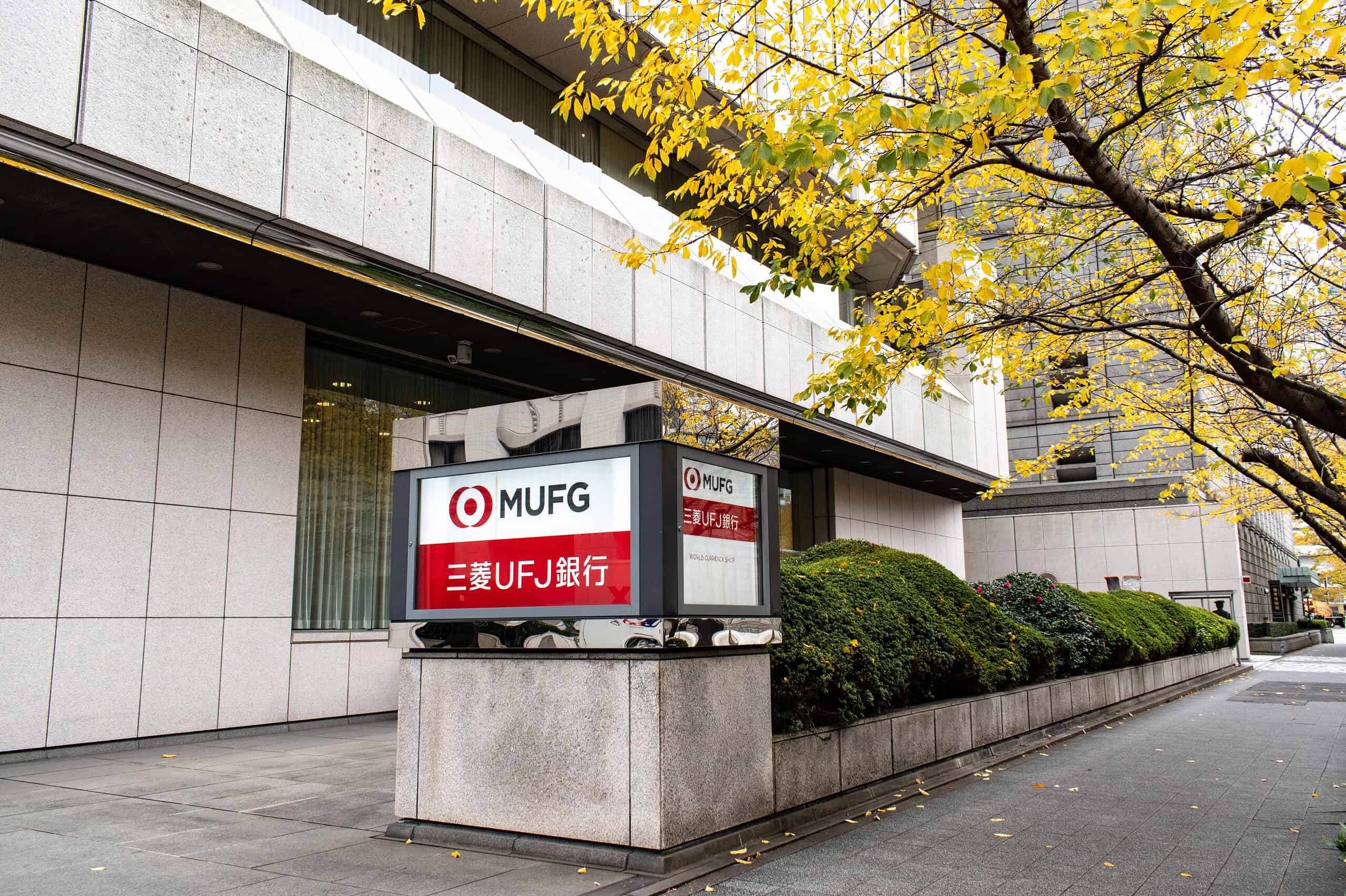 A sign logo of MUFG company at front side of thier office building with an exterior design in Nihonbashi Tokyo.