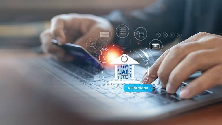 A person using a laptop and holding a credit card with AI banking icons. Concept of artificial intelligence in financial technology, secure online transactions, and digital finance.