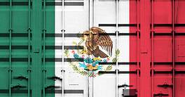 Shipping container with Mexican national flag overlay symbolizing tariffs and international trade policies in global commerce context.