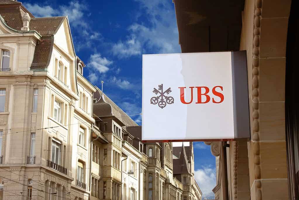 UBS sign on the wall of an UBS office building. UBS is a Swiss global financial services bank, headquartered in the Swiss city of Zurich.