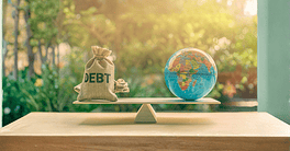 World or global / national debt crisis or imbalance concept : Debt bag and world globe on a balance scale, depicts the government's fiscal profligacy, excessive expenditure or increase public spending