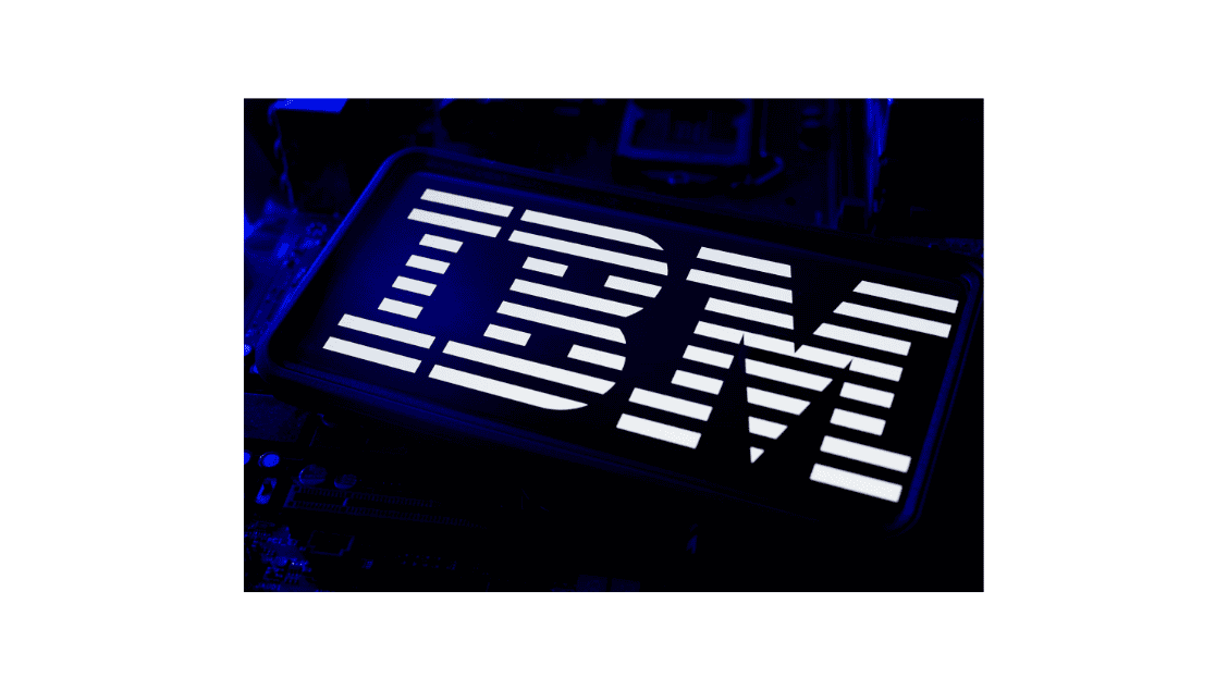 IBM Company Logo Illuminated On Smartphone Screen With Blue CPU Computer LED Motherboard And Circuit Wafer Chip Technology Background