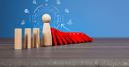 Wooden figure stops falling red domino blocks symbolizing risk management, crisis prevention, and strategic decision-making. Abstract icons represent legal, global, and business responsibility