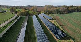 Modern solar power plant, photovoltaic panels green energy electricity production,new power plant,European energy crisis 2022, green deal,Czech republic,European Union,aerial panorama from foggy cloud