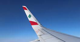 The wing of a Middle East Airline plane with the cedar emblem.