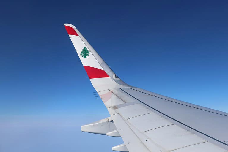 The wing of a Middle East Airline plane with the cedar emblem.
