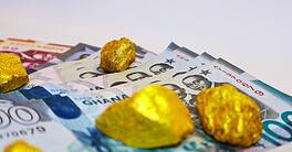 Ghana bills with gold nugget