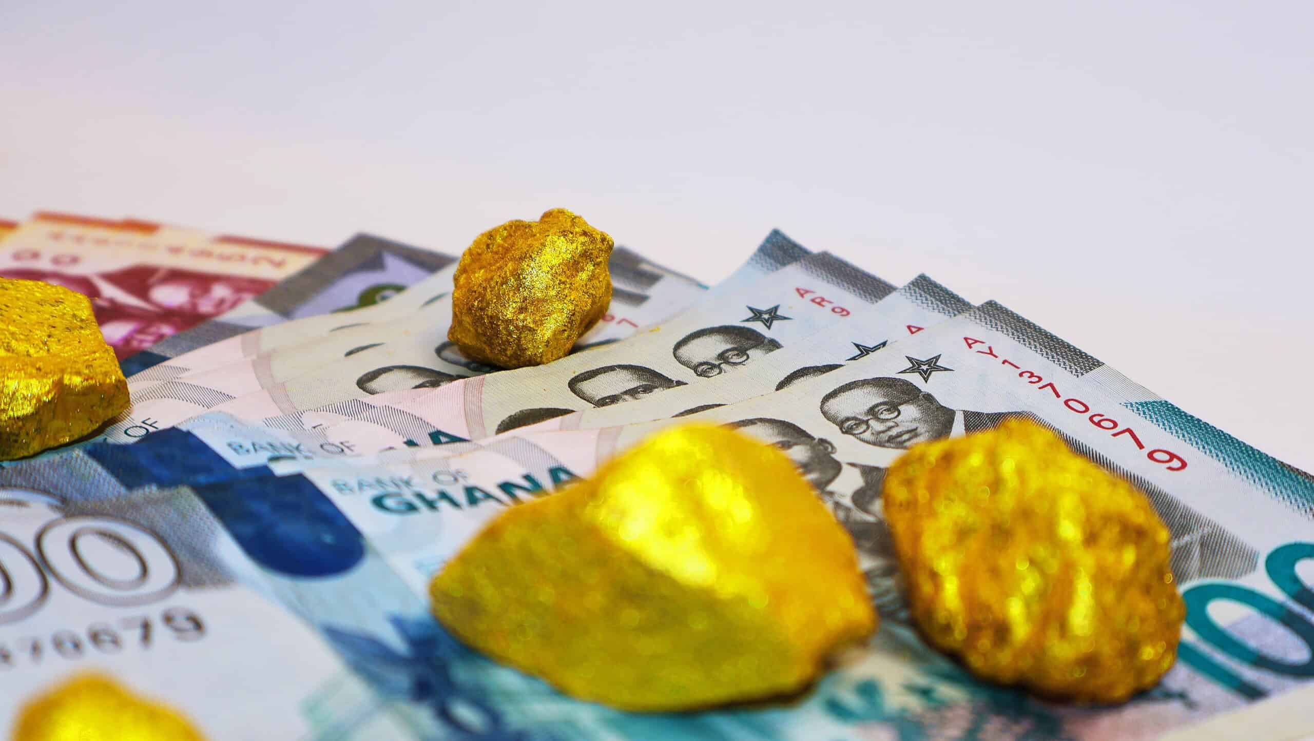Ghana bills with gold nugget