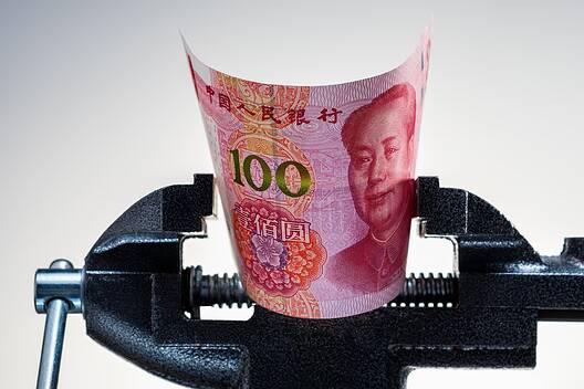 Chinese economy crisis. Pressing on yuan banknote. Inflation, restrictions in China. Yuan money under pressure.