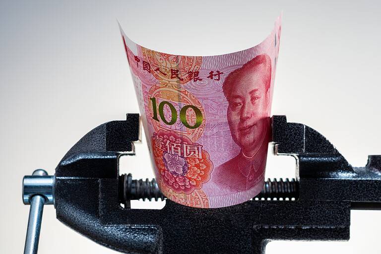 Chinese economy crisis. Pressing on yuan banknote. Inflation, restrictions in China. Yuan money under pressure.