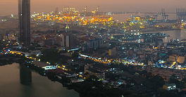 Modern Skyline of Colombo at Night with Glowing Lights and Ocean View