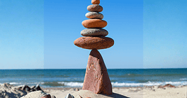 Rock zen pyramid balanced on a cliff edge on the beach. Concept of Life balance, harmony and meditation