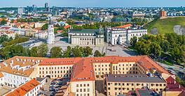 A panoramic view of Vilnius, Lithuania, showcasing historic architecture and modern city skyline.