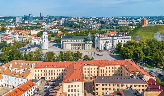 A panoramic view of Vilnius, Lithuania, showcasing historic architecture and modern city skyline.