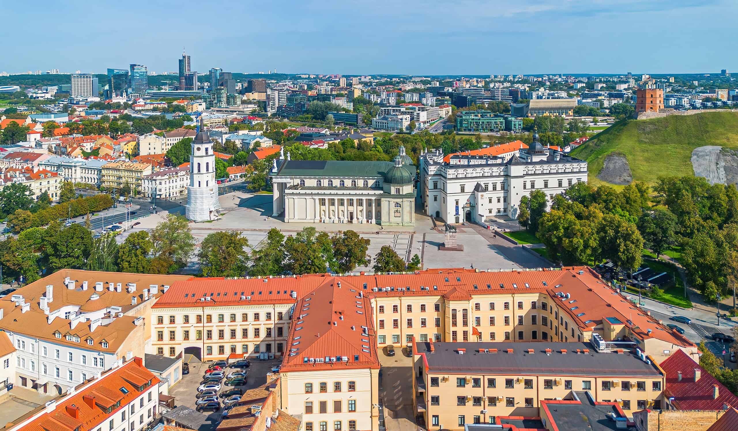 A panoramic view of Vilnius, Lithuania, showcasing historic architecture and modern city skyline.