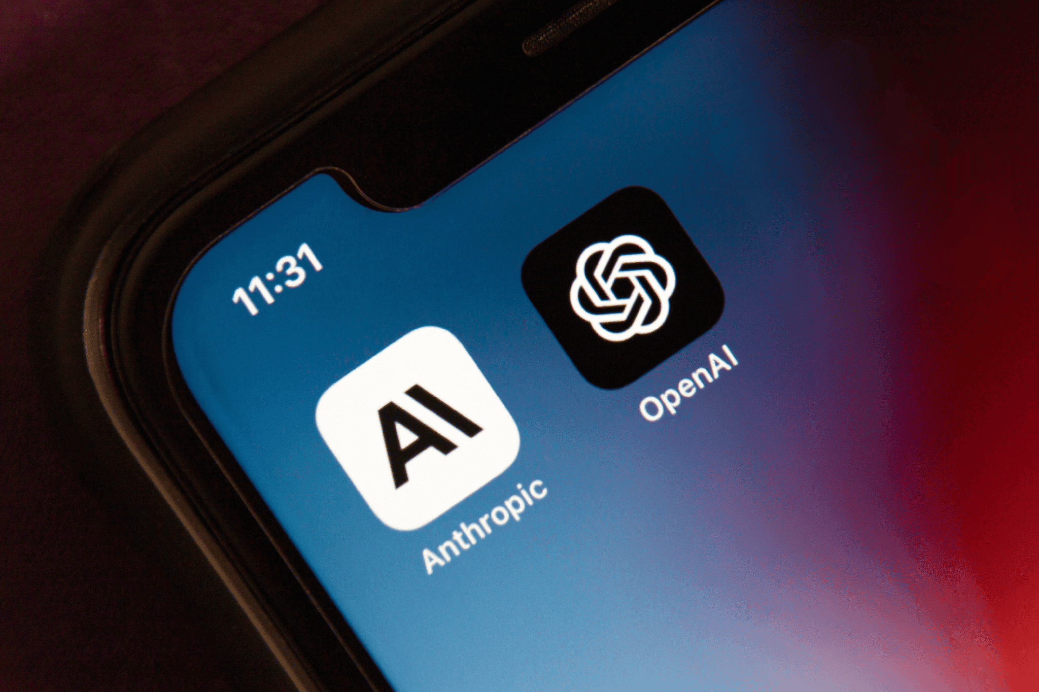 Anthropic, Openai logos on a smartphone