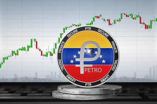 Venezuela Petro digital currency coin with stock market graph background.