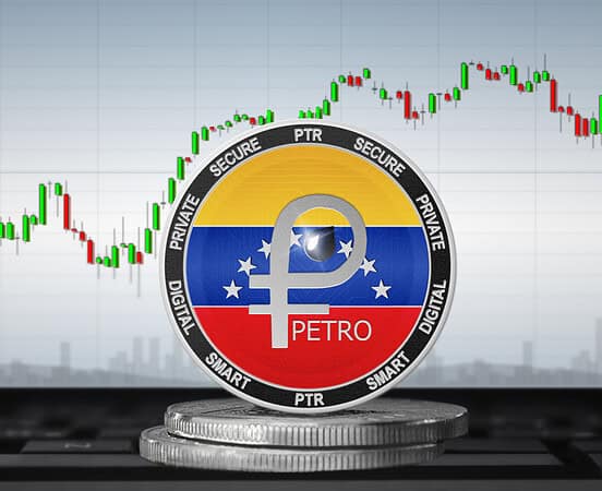 Venezuela Petro digital currency coin with stock market graph background.