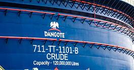 Oil tanker DANGOTE with capacity of 120 million liters docked at port.