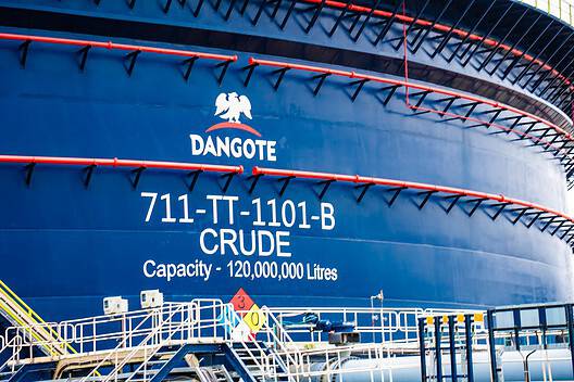 Oil tanker DANGOTE with capacity of 120 million liters docked at port.