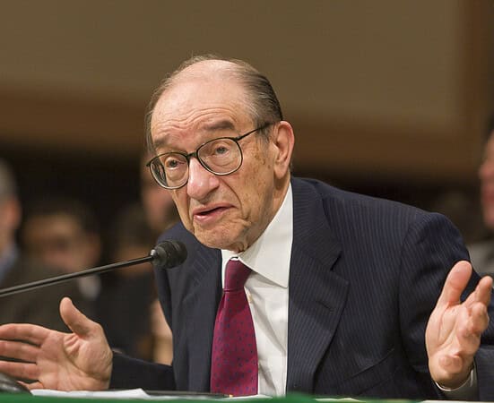 Alan Greenspan speaking at a congressional hearing about economic policy.