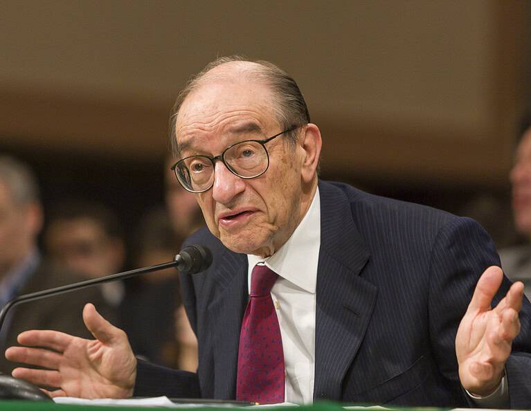 Alan Greenspan speaking at a congressional hearing about economic policy.