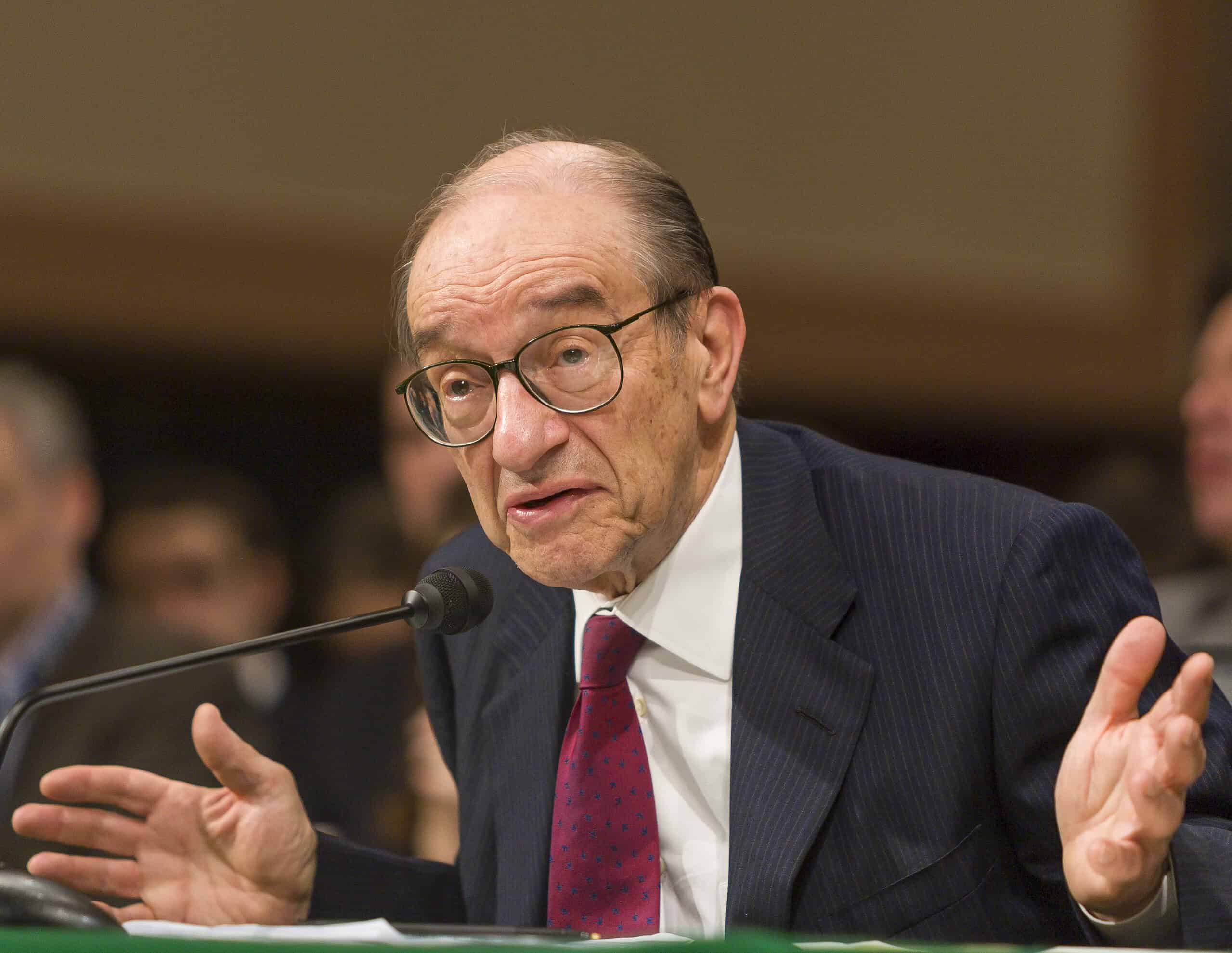 Alan Greenspan speaking at a congressional hearing about economic policy.