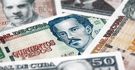 Cuban peso money bills pile on table. Cuba banknotes of CUP currency close up. Concept of business, economy and banking in Cuba