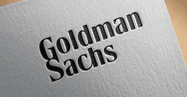 Minimal branding visual featuring Goldman Sachs logo printed on an angled white paper, symbolizing Goldman Sachs stock in a financial Stock market, investment