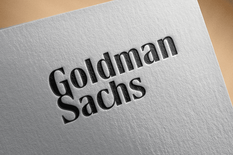 Minimal branding visual featuring Goldman Sachs logo printed on an angled white paper, symbolizing Goldman Sachs stock in a financial Stock market, investment