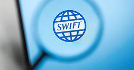 Swift logo on digital screen representing global financial transactions.