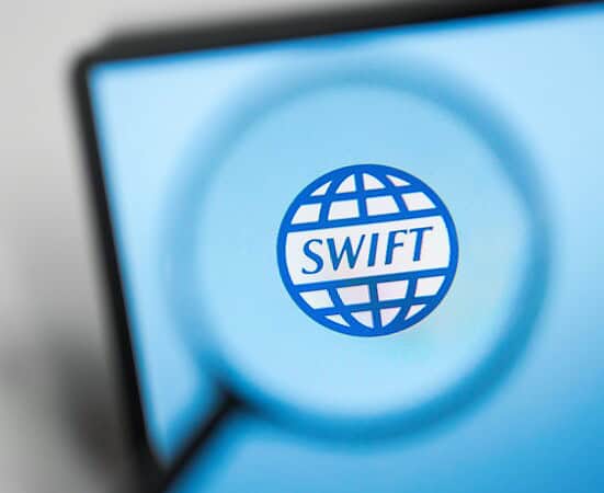 Swift logo on digital screen representing global financial transactions.