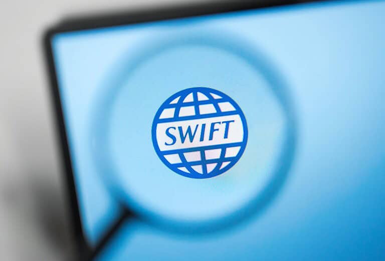 Swift logo on digital screen representing global financial transactions.