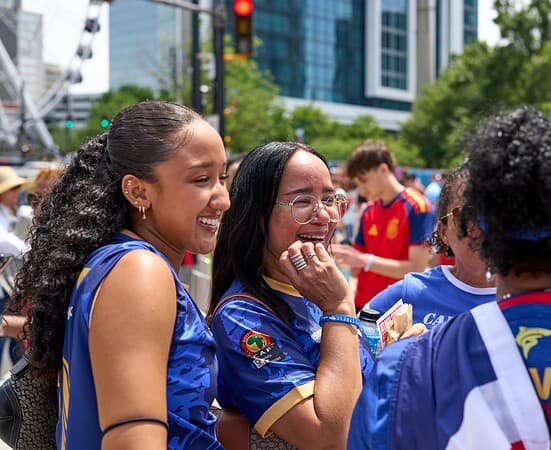FIFA World Cup 2026 fans wearing Spain and Cape Verde colors gather near the Olympic Rings at Centennial Olympic Park before the match in Atlanta.
