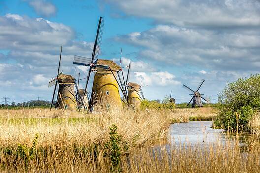 Kinderdijk, Netherlands - April 20, 2024: Kinderdijk, a village in the Netherlands, is famous for its iconic windmills built in the 18th century