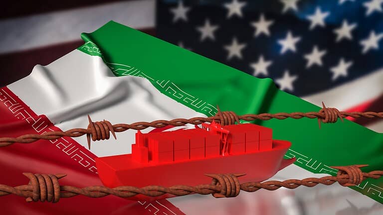 Cargo ship trapped by barbed wire with Iran and U.S. flags