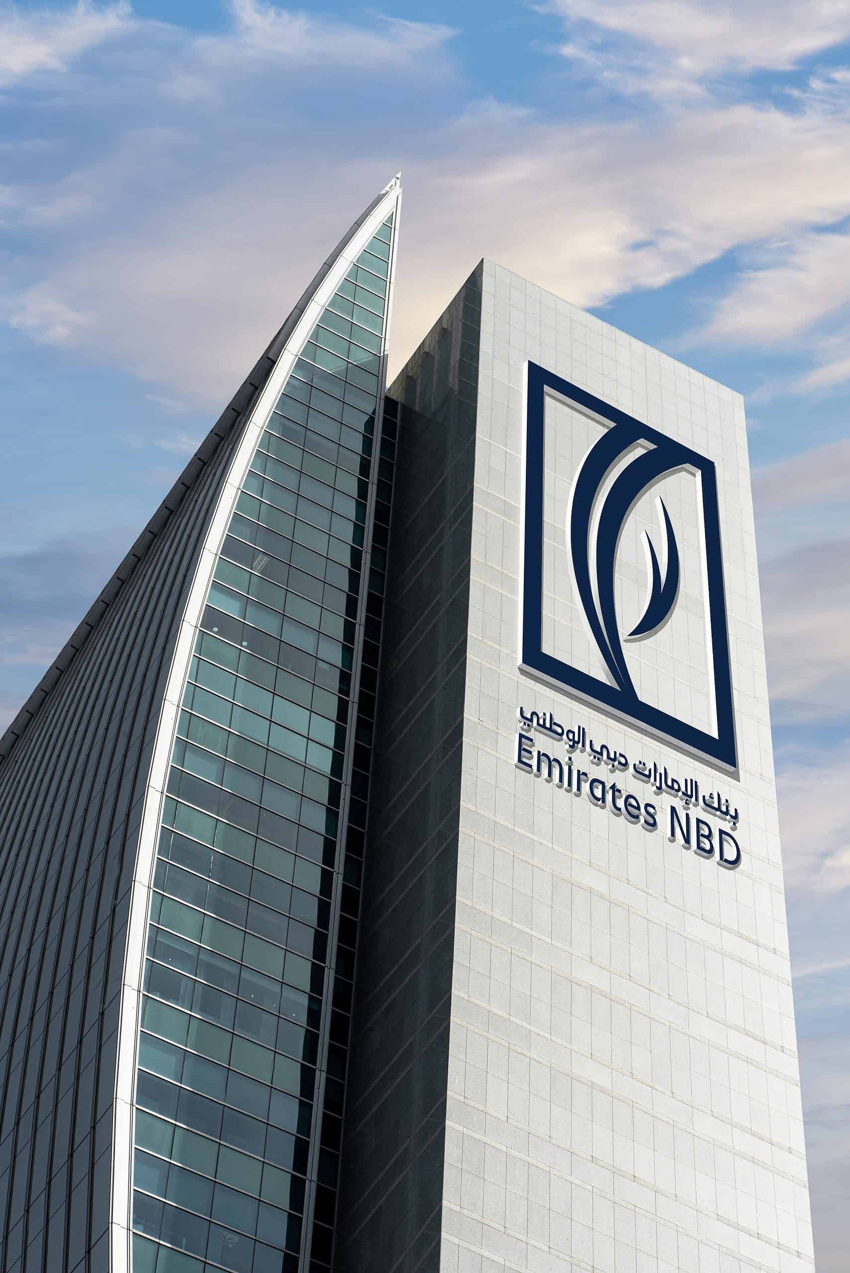 Emirates NBD Bank head office with sky and clouds in the background.