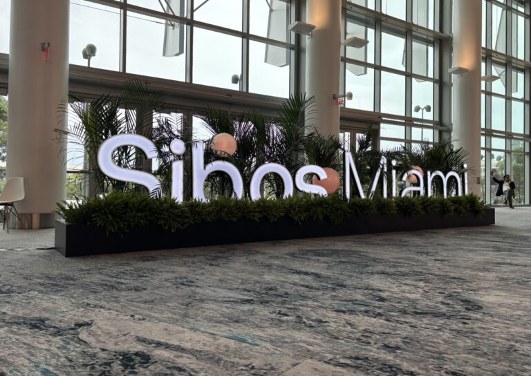 Sibos 2026 conference entrance sign in Miami Beach.