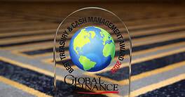 Global Finance World's Best Treasury & Cash Management Award glass plaque with a globe design.
