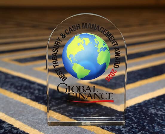 Global Finance World's Best Treasury & Cash Management Award glass plaque with a globe design.