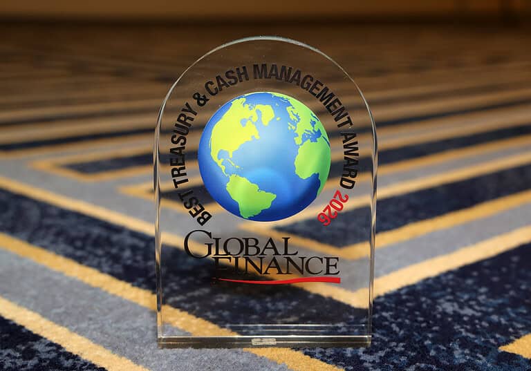 Global Finance World's Best Treasury & Cash Management Award glass plaque with a globe design.