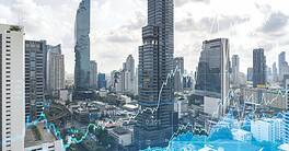 Forex and stock market chart hologram over panorama city view of Bangkok, the financial center in Southeast Asia. The concept of international trading. Double exposure.